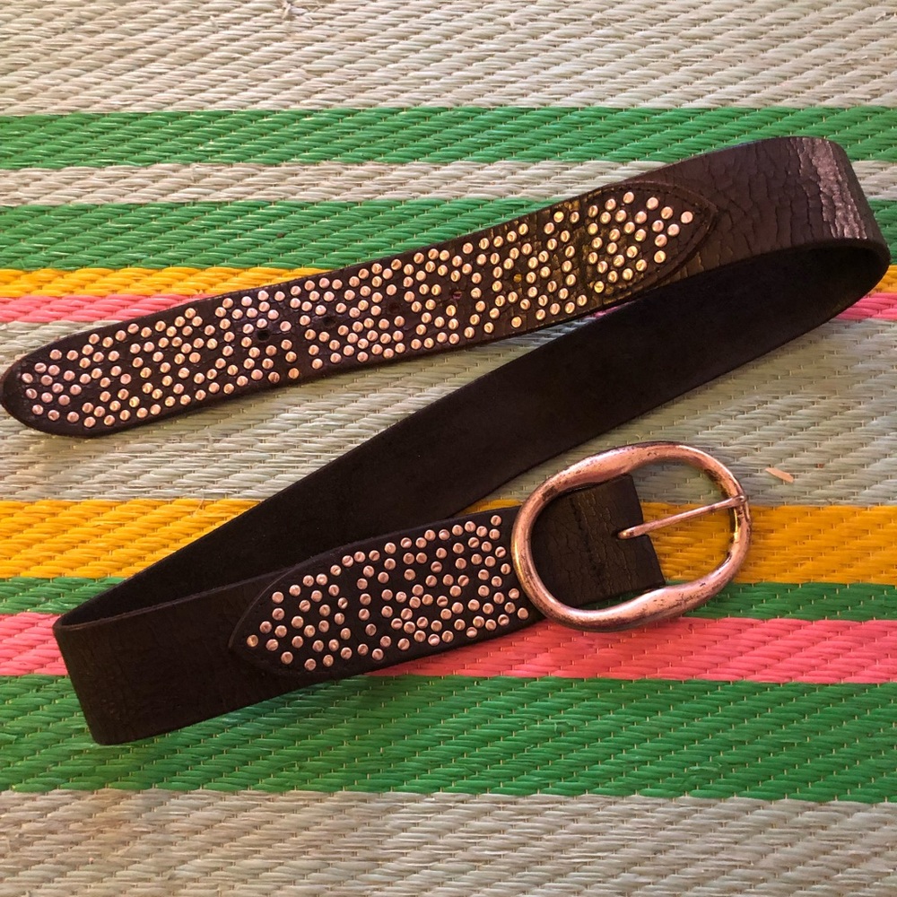 Black leather belt. Silver buckle.